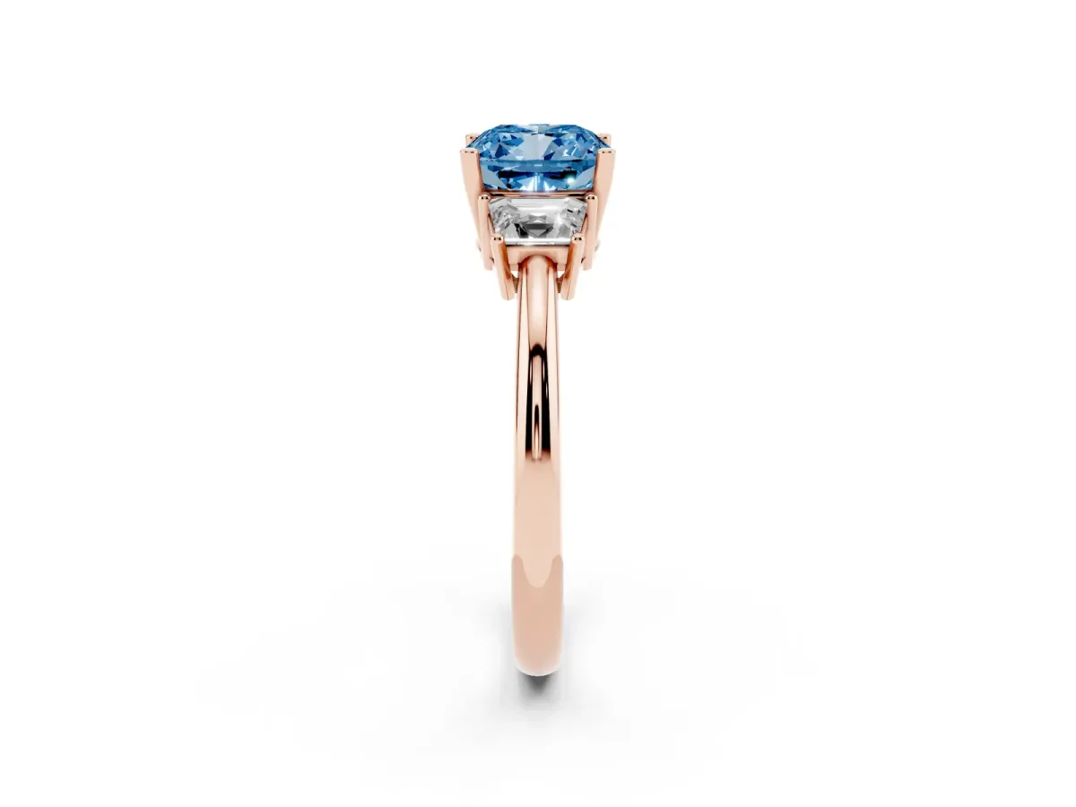 Fancy Blue Cushion Cut Diamond Three-Stone Ring with Trapezoid Side Stones and Prong Setting Rose gold