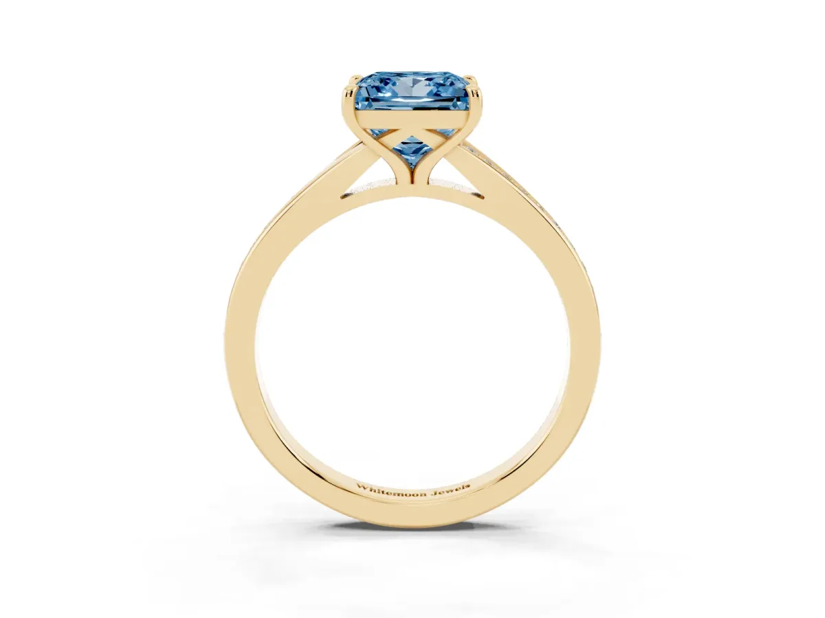Fancy Blue Princess Cut Diamond Solitaire Ring with Pavé Band and Prong Setting Yellow gold
