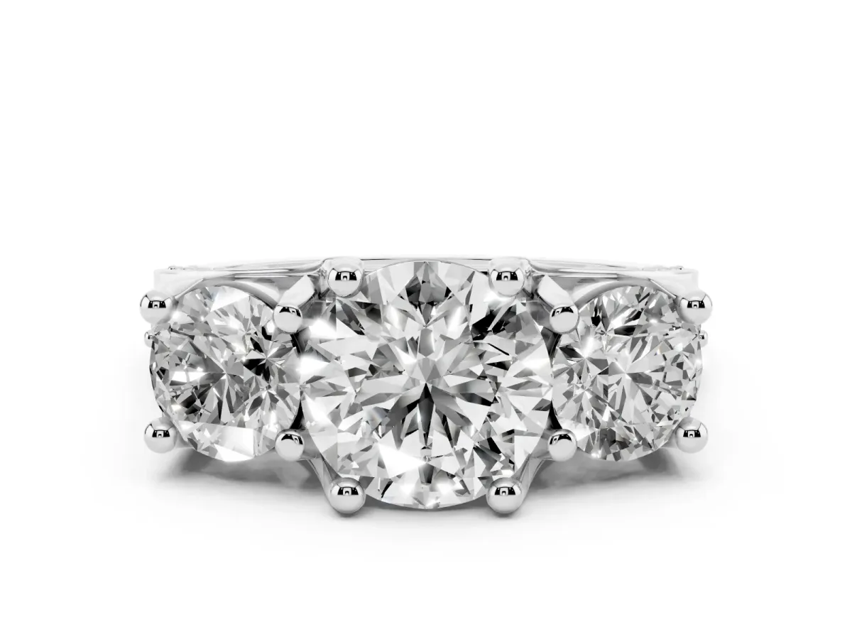 Round Cut Diamond Three-Stone Ring with Channel Set Band and Four-Prong Setting Silver