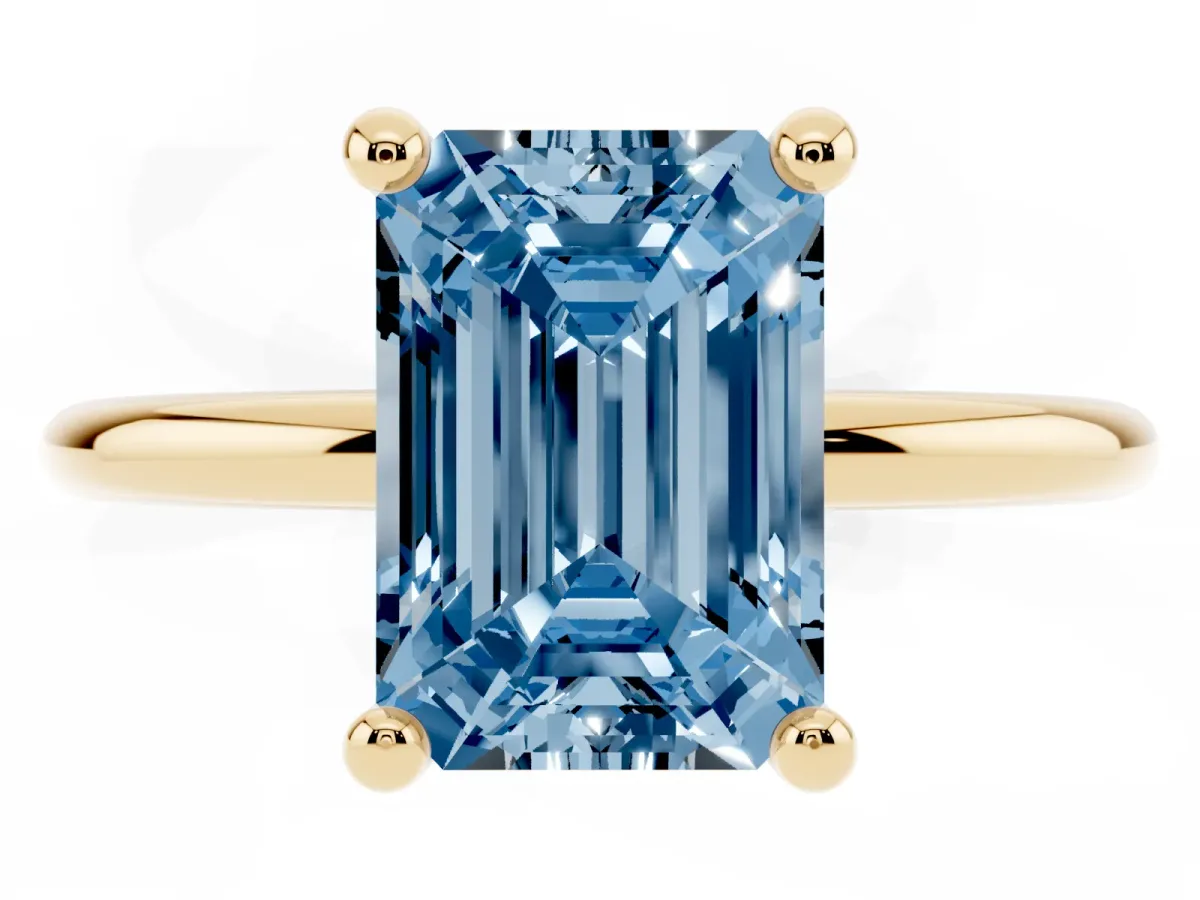 Fancy Blue Emerald Cut Solitaire Diamond Ring with 4-Prong Setting on a Classic Band Yellow gold