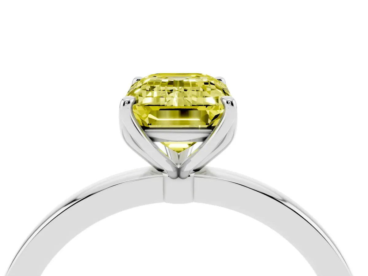 Fancy Yellow Emerald Cut Diamond Solitaire Ring with Thin Band and Prong Setting Silver
