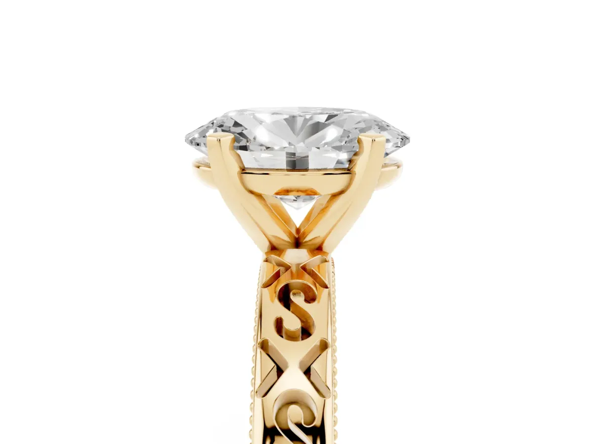 Oval Cut Solitaire Engagement Ring with Scrollwork Band and Four-Prong Setting Yellow gold