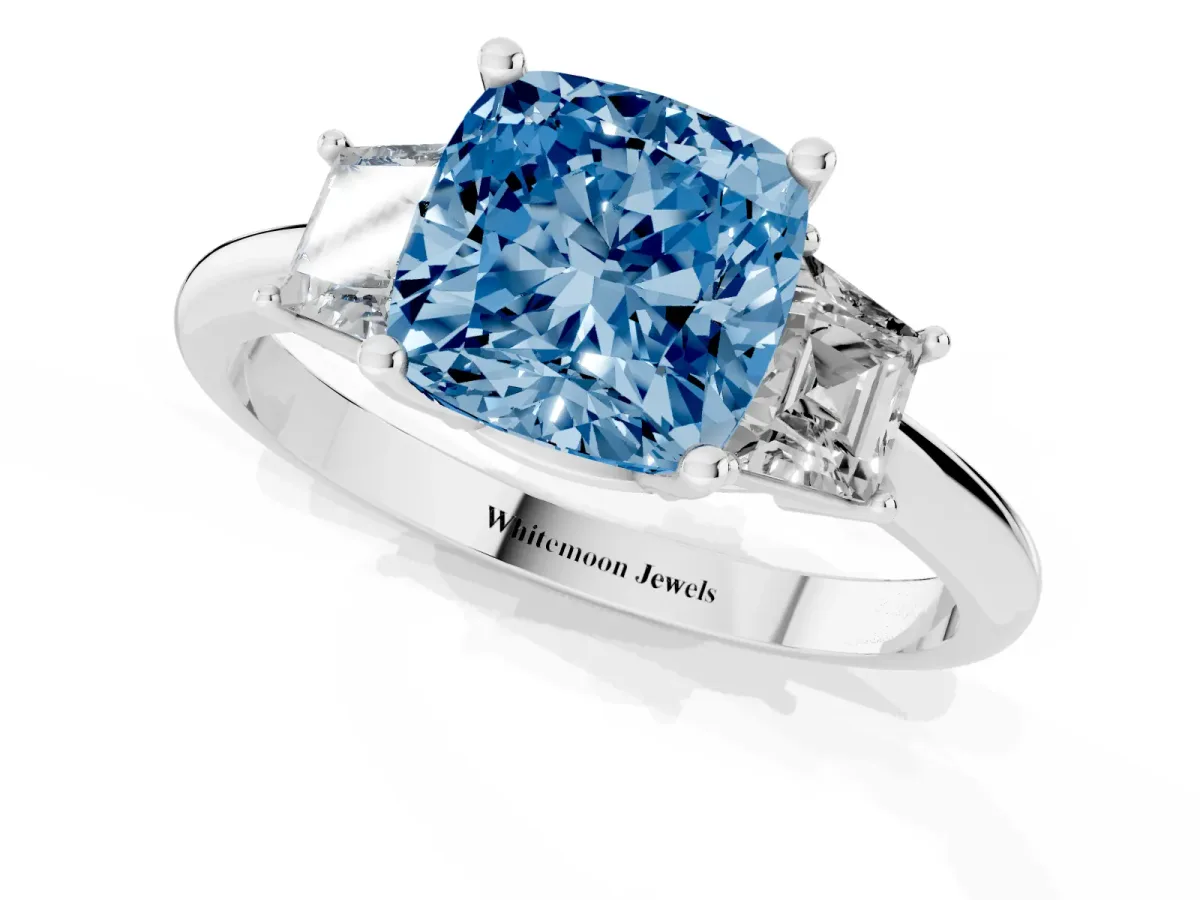 Fancy Blue Cushion Cut Diamond Three-Stone Ring with Trapezoid Side Stones and Prong Setting Platinum