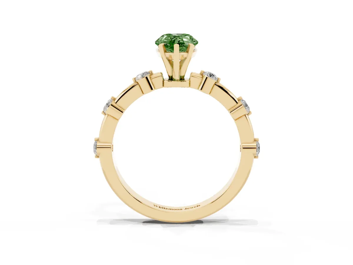 Fancy Green Pear Cut Solitaire Diamond Ring with Bezel Set Side Stones and Prong Setting Yellow gold