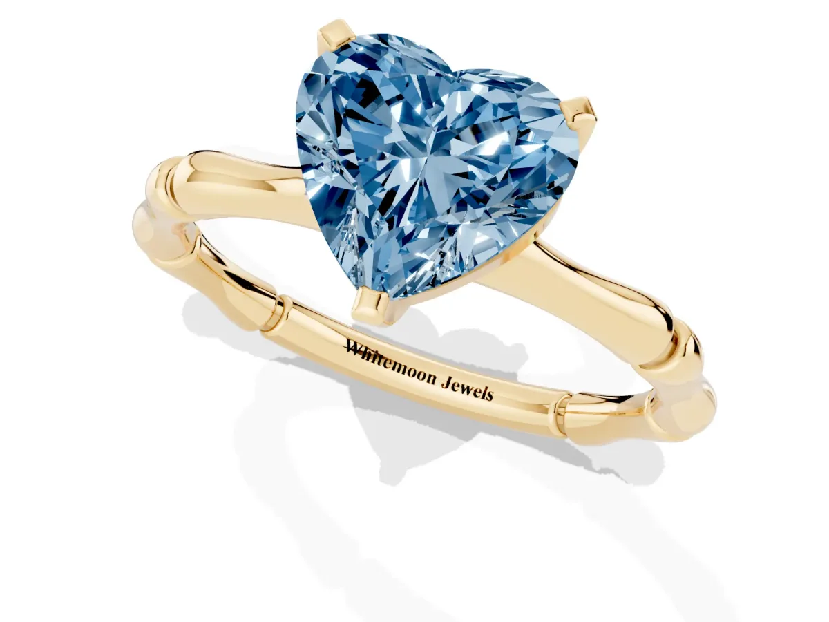 Fancy Blue Heart Cut Solitaire Diamond Ring with Bamboo Band and Four-Prong Setting Yellow gold