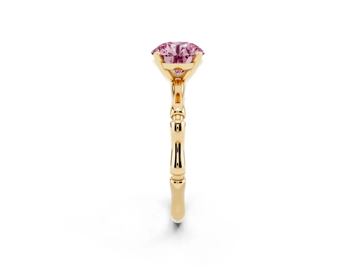 Fancy Pink Round Cut Solitaire Diamond Ring with Bamboo Band and Four-Prong Setting Yellow gold