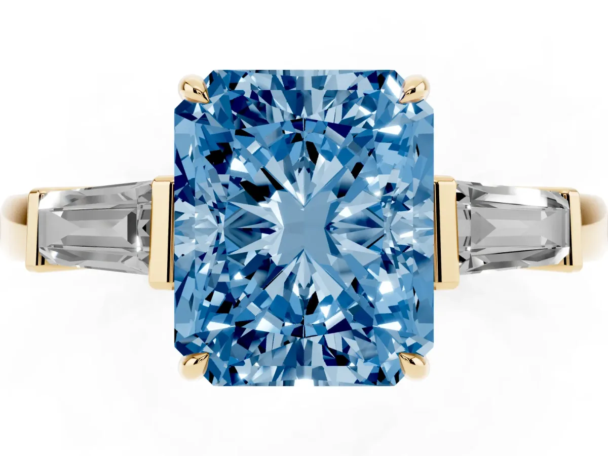 Fancy Blue Radiant Cut Diamond Three-Stone Ring with Tapered Baguette Side Stones and Prong Setting Yellow gold