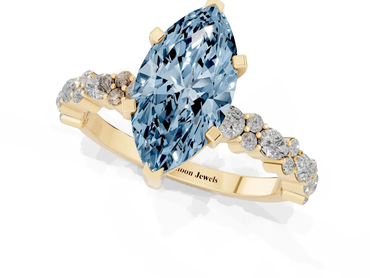 Fancy Blue Marquise Cut Diamond Side Stone Solitaire Ring with Round and Four-Prong Setting Yellow gold