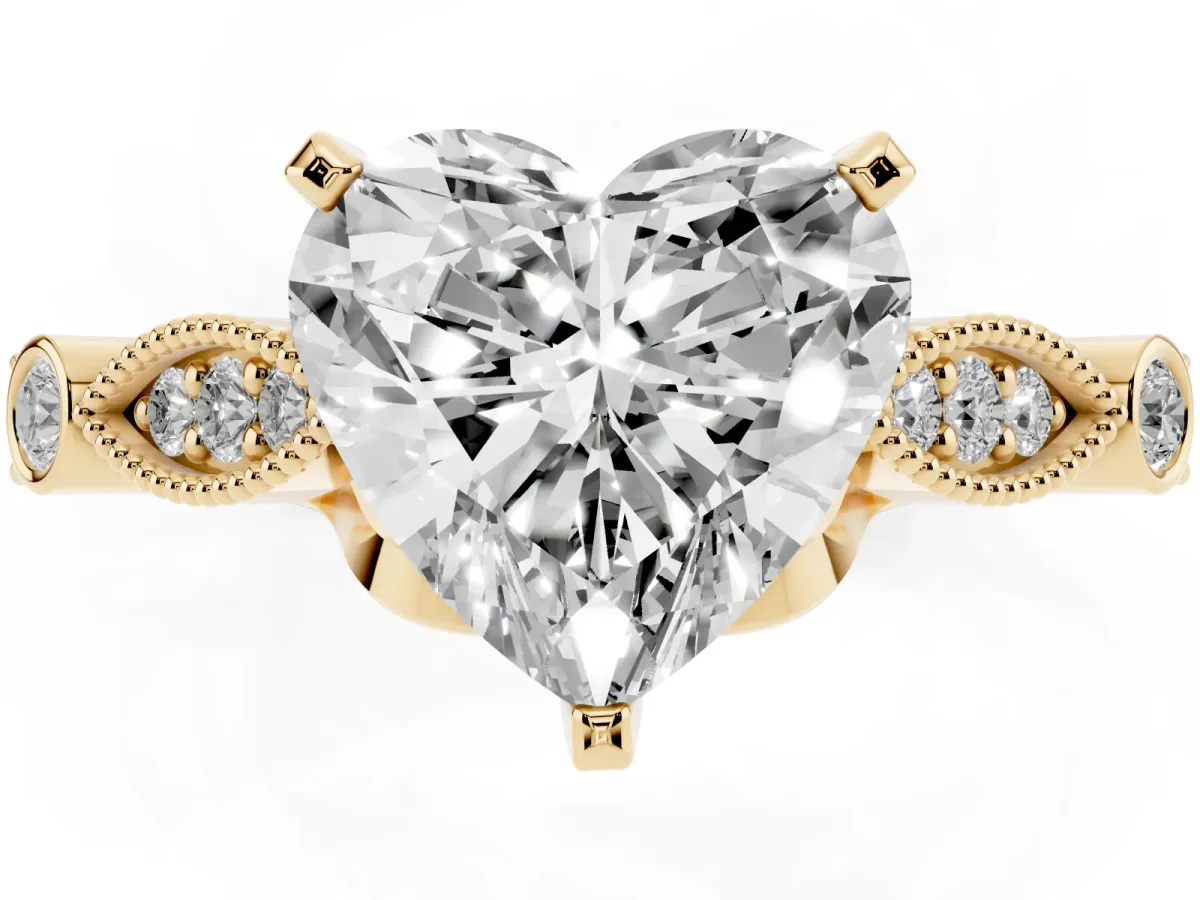 Heart Cut Cut Diamond with Milgrain Marquise and Bezel Accents on a Solitaire Band with Prong Setting Yellow gold
