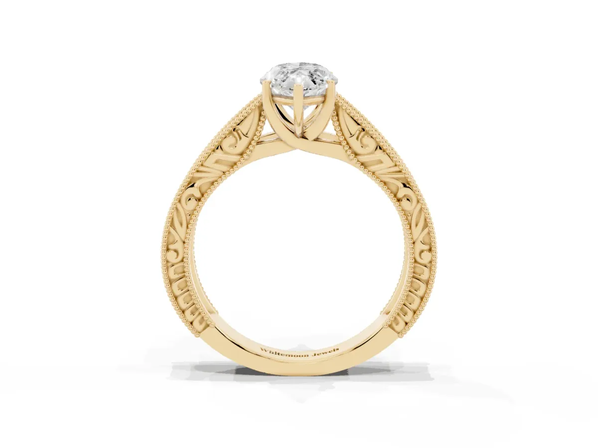 Marquise Cut Diamond Solitaire Ring with Engraved Band and Four-Prong Setting Yellow gold