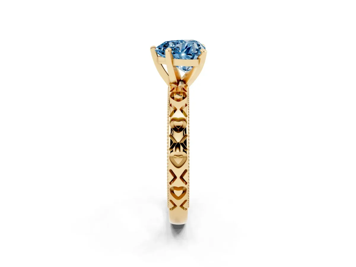 Fancy Blue Heart Cut Solitaire Diamond Engagement Ring with XO Engraved Band and Four-Prong Setting Yellow gold