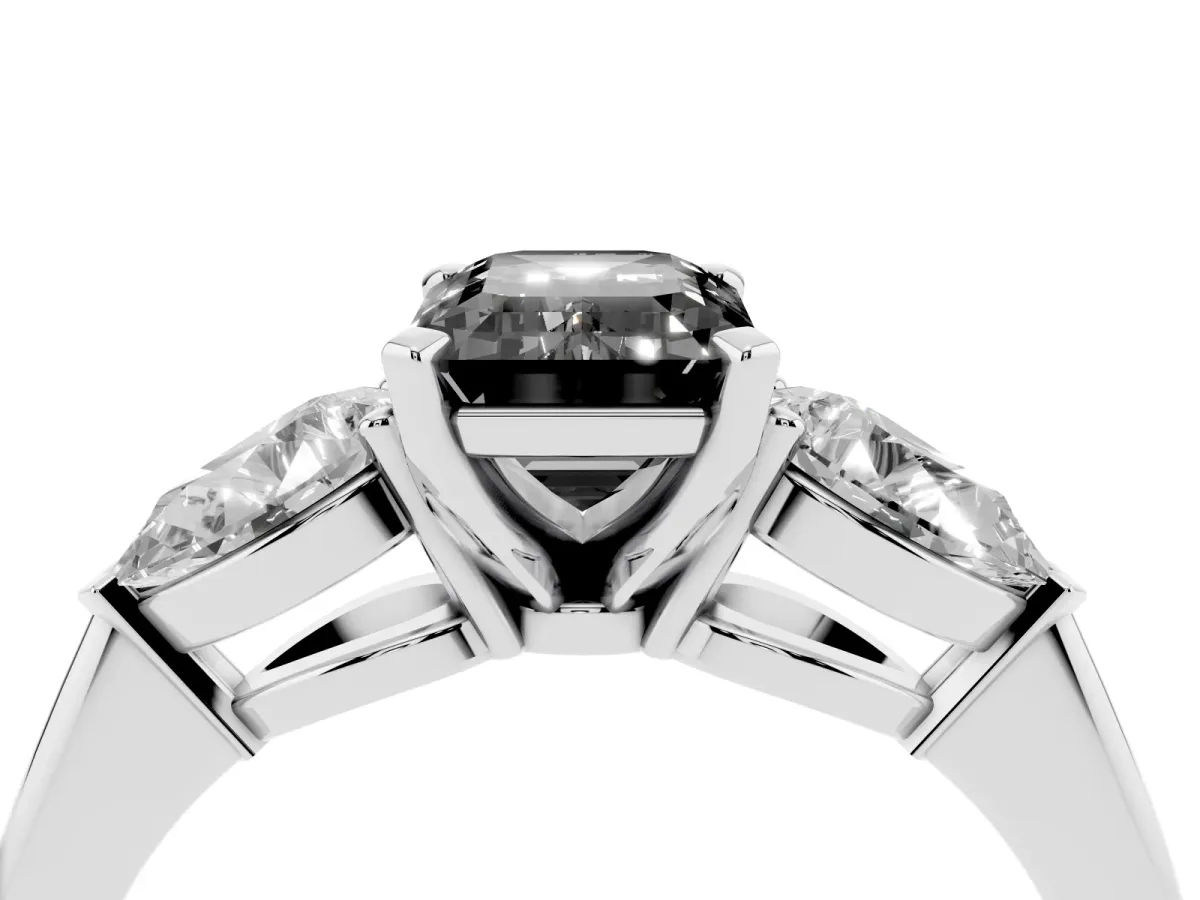 Fancy Black Three-Stone Emerald Cut Diamond Ring with Pear Side Stones and Four-Prong Setting Platinum