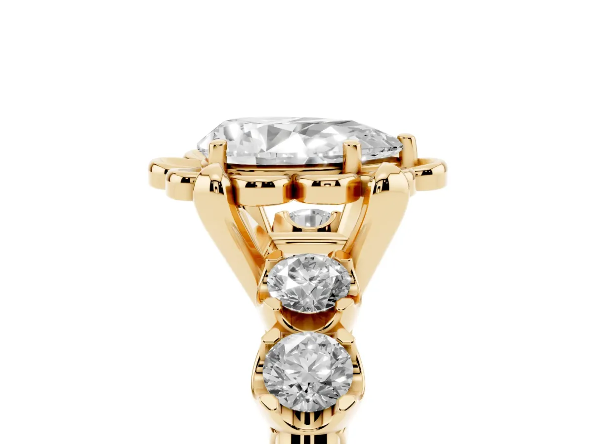 Pear Cut Cut Diamond Floral Halo Engagement Ring with Shared Prong Setting Yellow gold