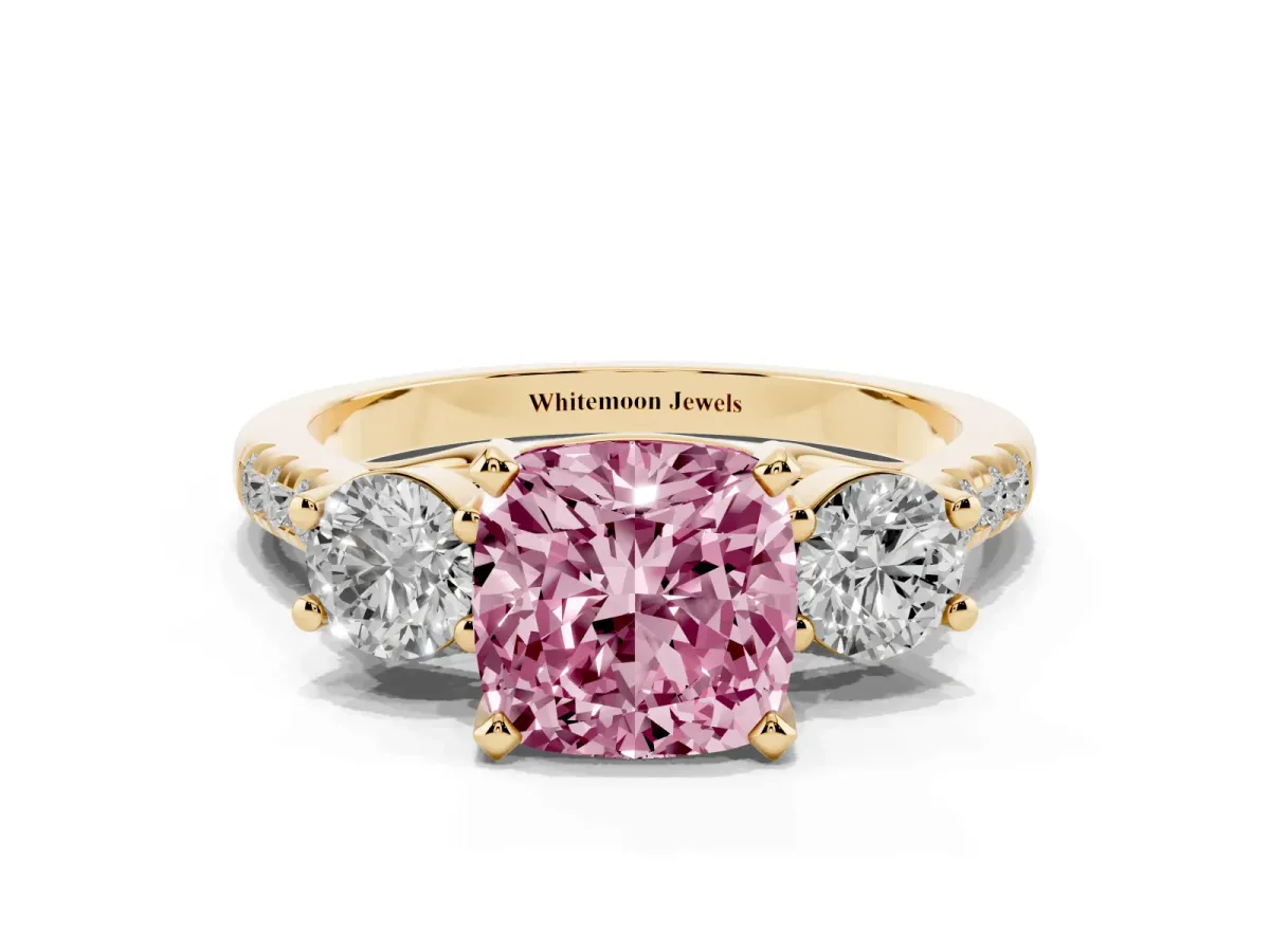 Fancy Pink Three-Stone Cushion Cut Diamond Pavé Band with Four-Prong Setting Yellow gold