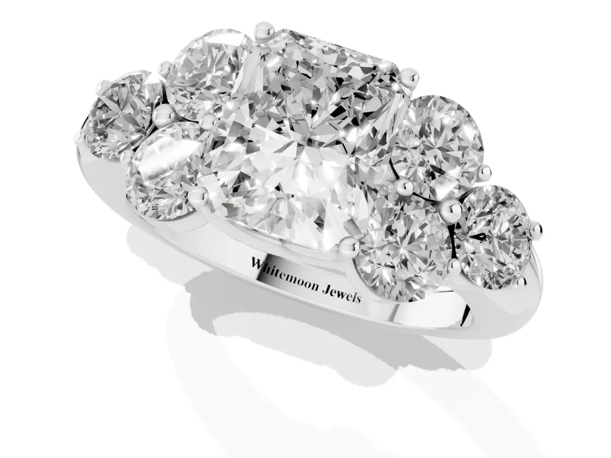 Radiant Cut Cut Diamond Cluster Ring with Round Accent Stones and Prong Setting on a Classic Band White gold