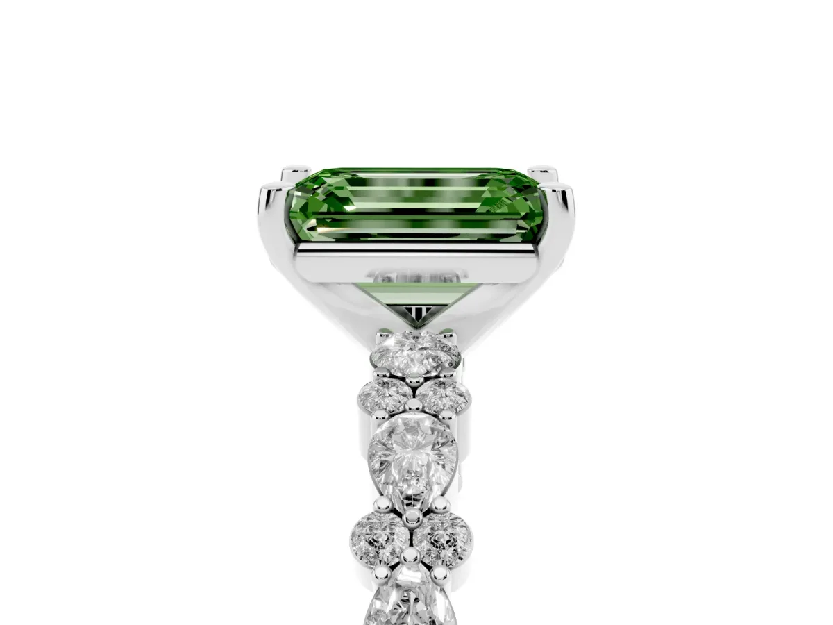 Fancy Green Emerald Cut Diamond Side Stone Solitaire Ring with Round and Four-Prong Setting Silver