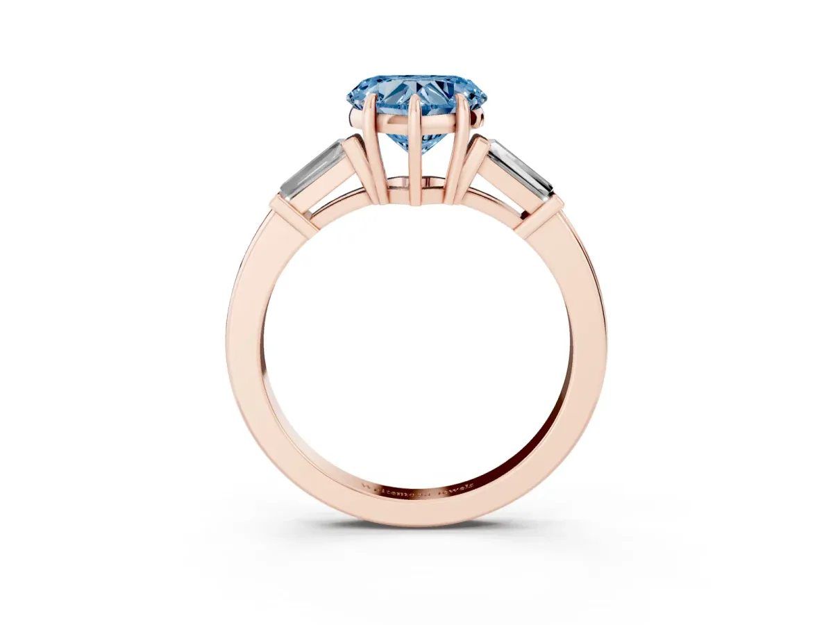 Fancy Blue Heart Cut Diamond Three-Stone Ring with Tapered Baguette Side Stones and Prong Setting Rose gold