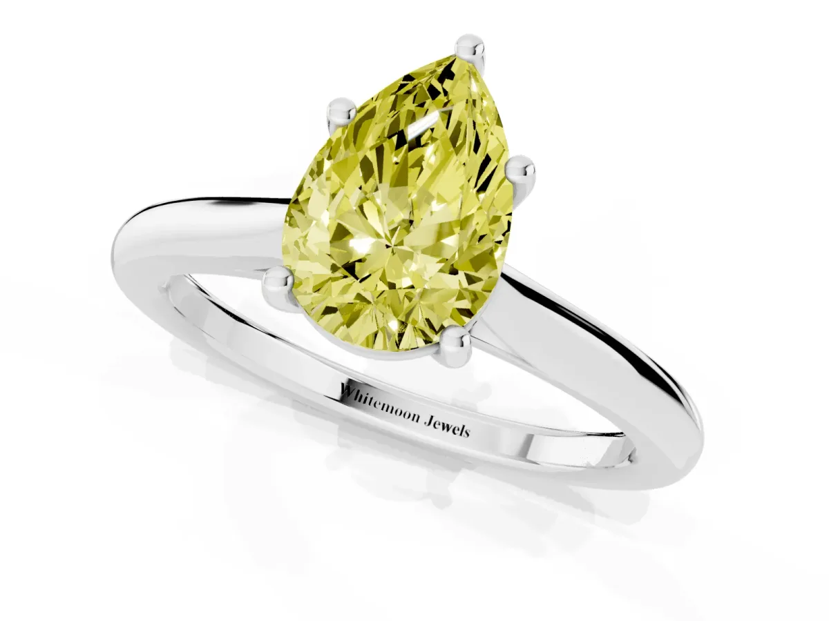 Fancy Yellow Pear Cut Cut Solitaire Ring with Cathedral Band and Four-Prong Setting Silver