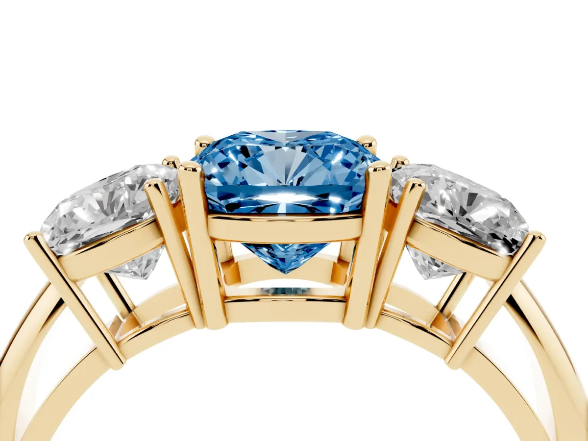 Fancy Blue Three-Stone Cushion Cut Cut Diamond Engagement Ring with Prong Setting on a White Gold Band Yellow gold