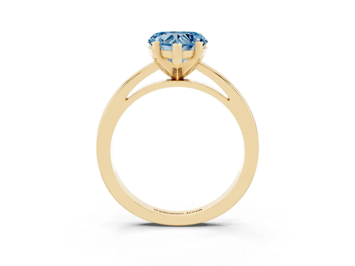 Fancy Blue Heart Cut Solitaire Diamond Engagement Ring with Four-Prong Setting on a Classic Band Yellow gold
