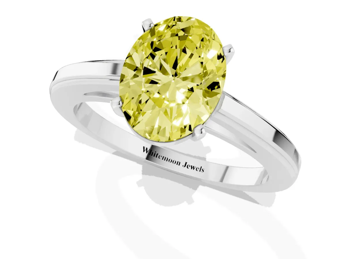 Fancy Yellow Oval Cut Solitaire Diamond Ring with Four-Prong Setting and Classic Band Platinum
