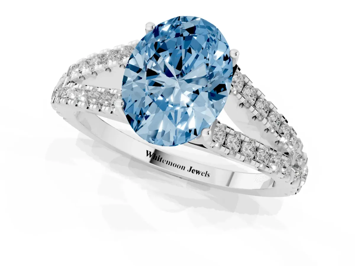 Fancy Blue Oval Cut Diamond Split Shank Pavé Engagement Ring with Four-Prong Setting Silver