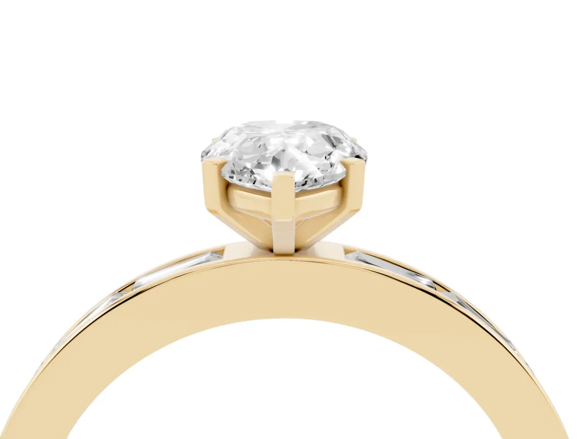 Pear Cut Solitaire Diamond Ring with Channel-Set Baguette Band and Four-Prong Setting Yellow gold