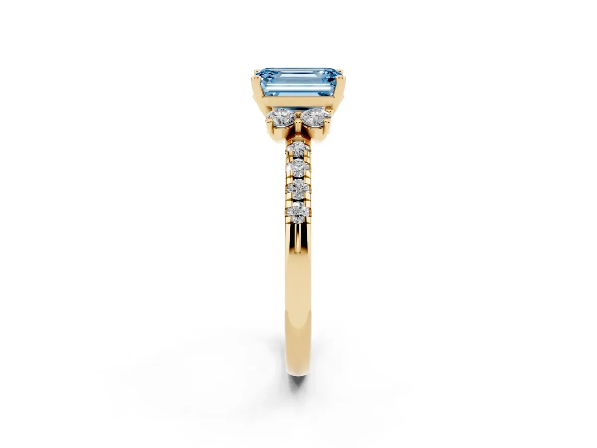 Fancy Blue Emerald Cut Diamond Three-Stone Pave Band with Four-Prong Setting Yellow gold