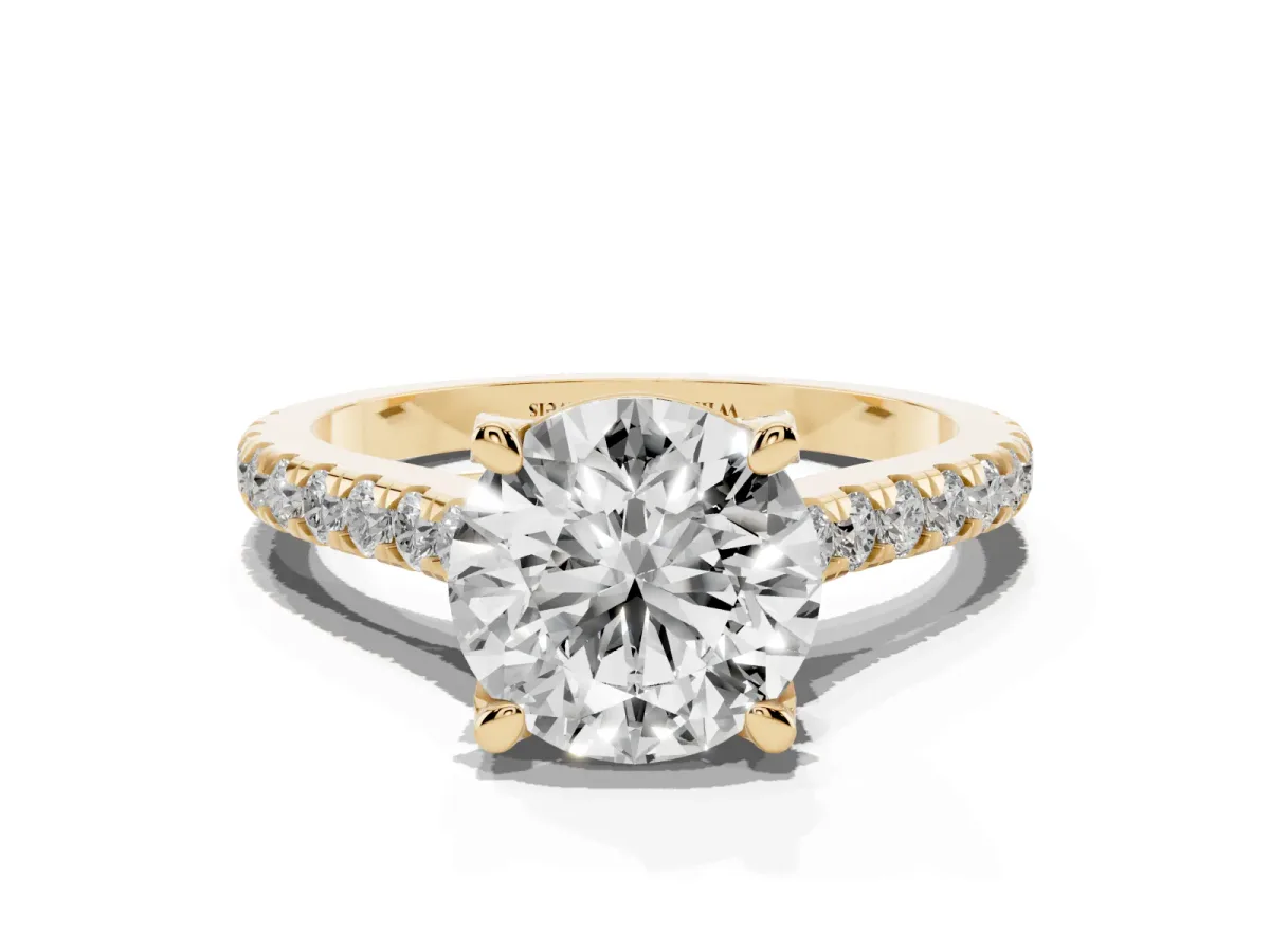 Round Cut Brilliant Diamond Solitaire with Pavé Band and Four-Prong Setting Yellow gold