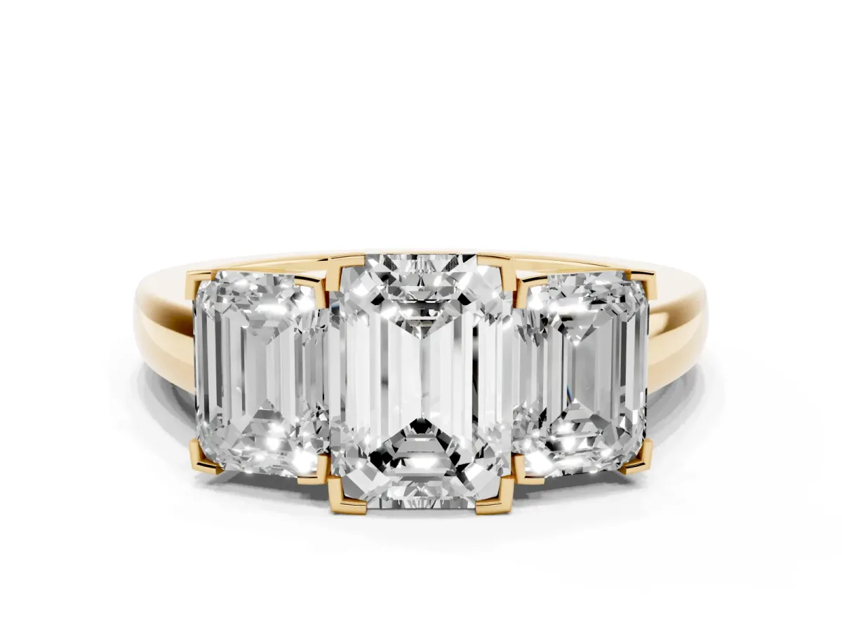 Three-Stone Emerald Cut Cut Diamond Ring with Channel Set Band and Four-Prong Setting Yellow gold