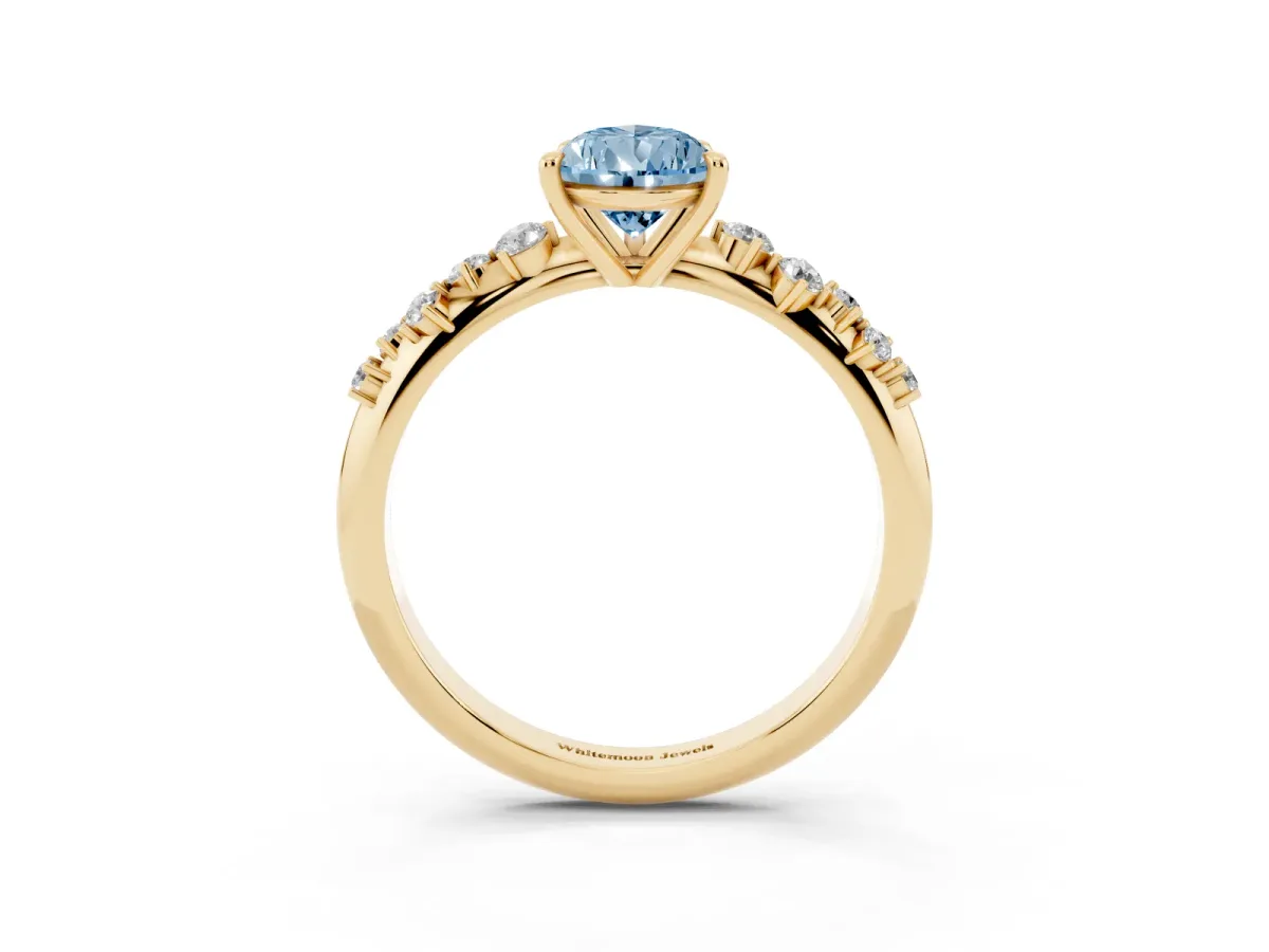 Fancy Blue Pear Cut Diamond Cluster Side Stone Solitaire Ring with Prong Setting Yellow gold