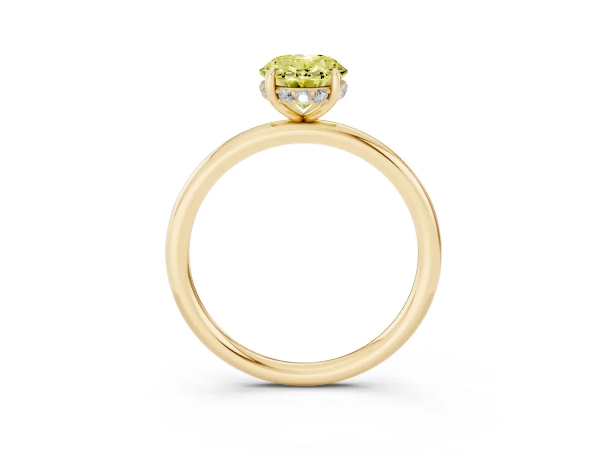 Fancy Yellow Oval Cut Solitaire Diamond Ring with a Classic Band and Four-Prong Setting Yellow gold