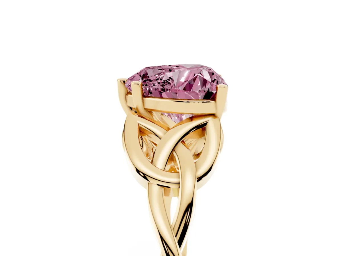 Fancy Pink Heart Cut Diamond Solitaire Engagement Ring with Celtic Knot Band and Four-Prong Setting Yellow gold