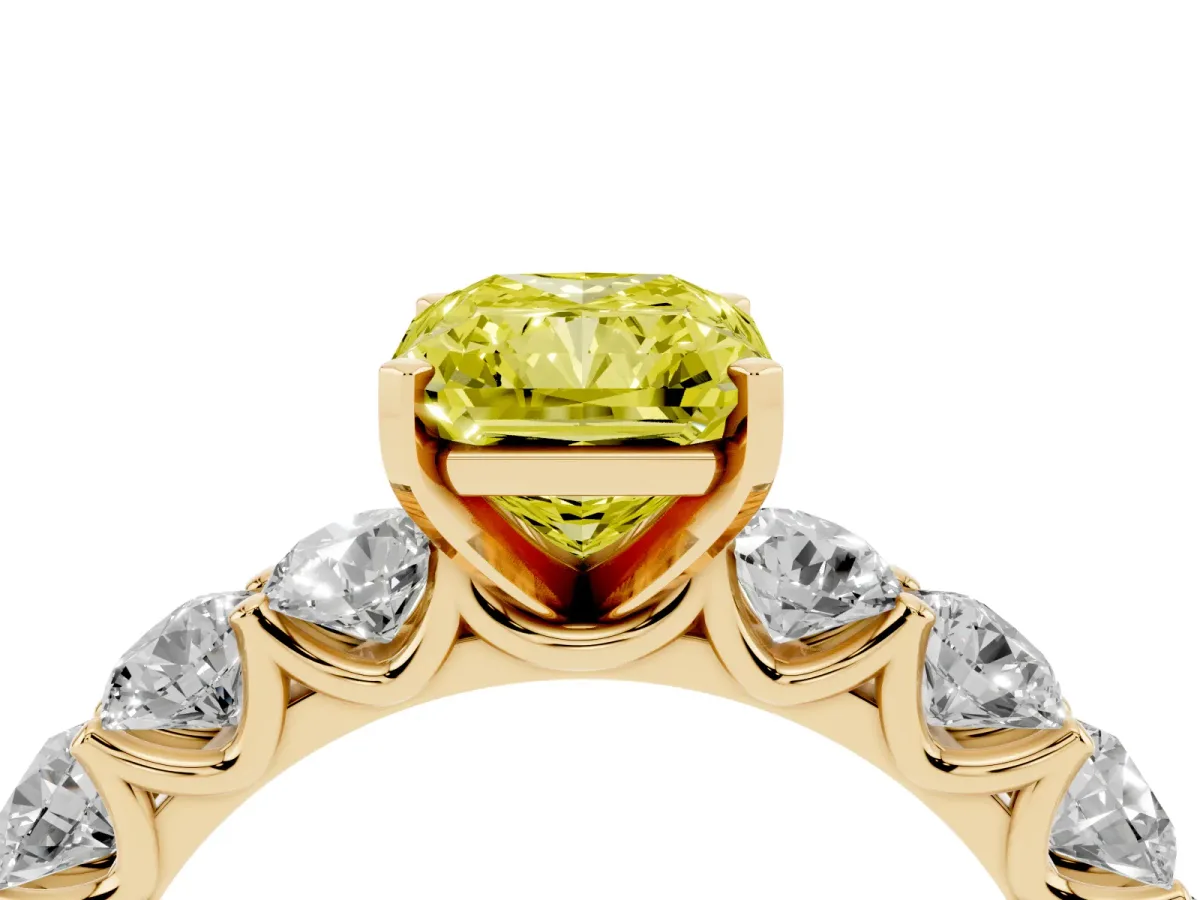 Fancy Yellow Radiant Cut Diamond Prong Setting with Side Stones on a Pave Band Yellow gold