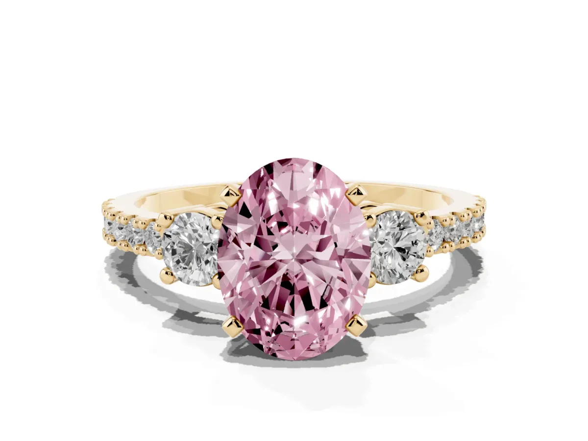 Fancy Pink Oval Cut Three-Stone Diamond Pavé Band with Prong Setting Yellow gold