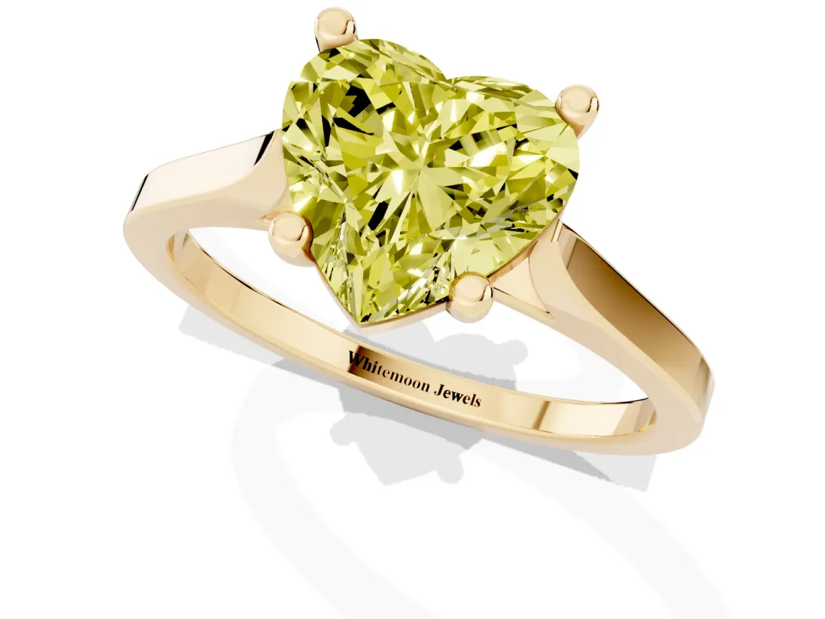 Fancy Yellow Heart Cut Solitaire Diamond Ring with Four-Prong Setting and Tapered Band Yellow gold