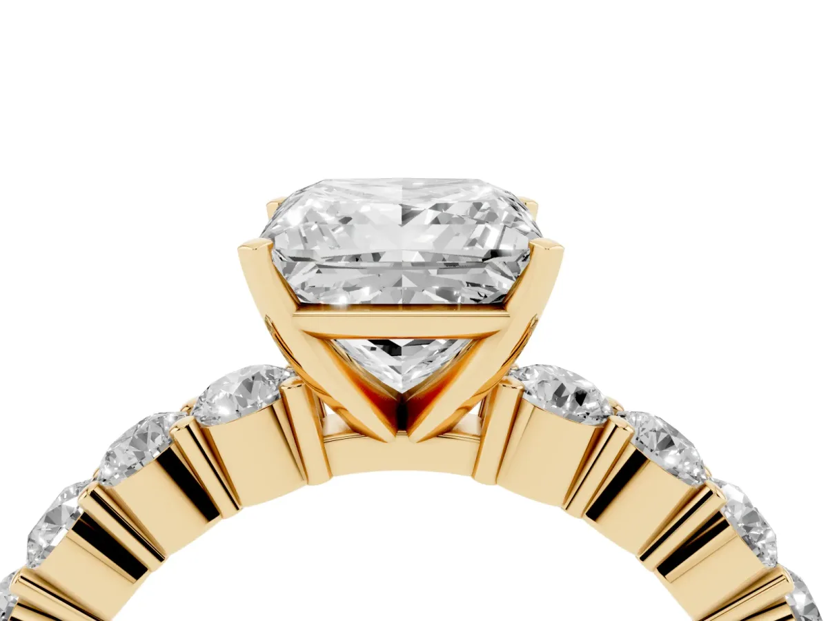 Princess Cut Diamond Solitaire Ring with Shared Prong Round Side Stones Yellow gold
