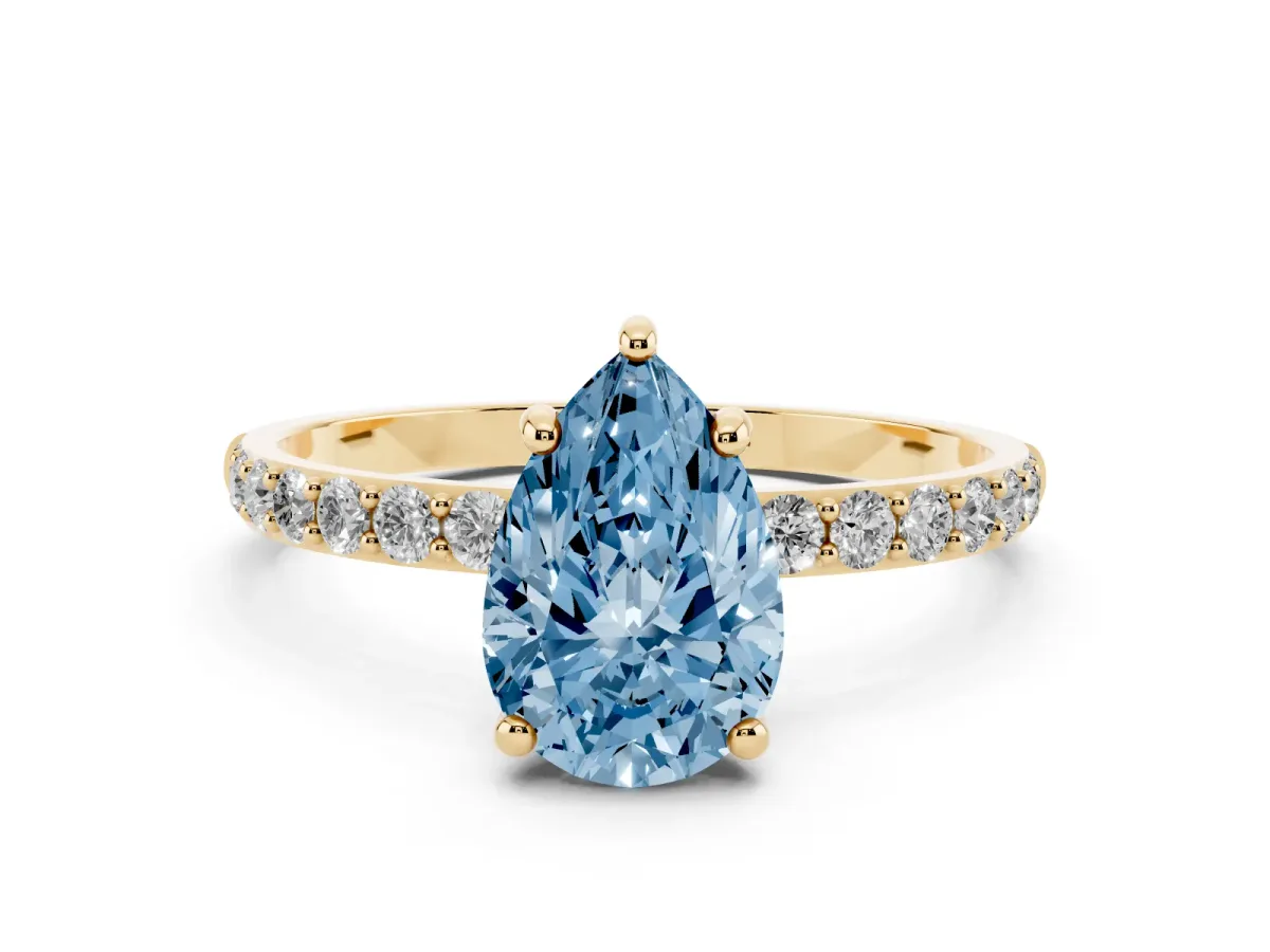 Fancy Blue Pear Cut Diamond Solitaire Ring with Round Pavé Band and Prong Setting Yellow gold