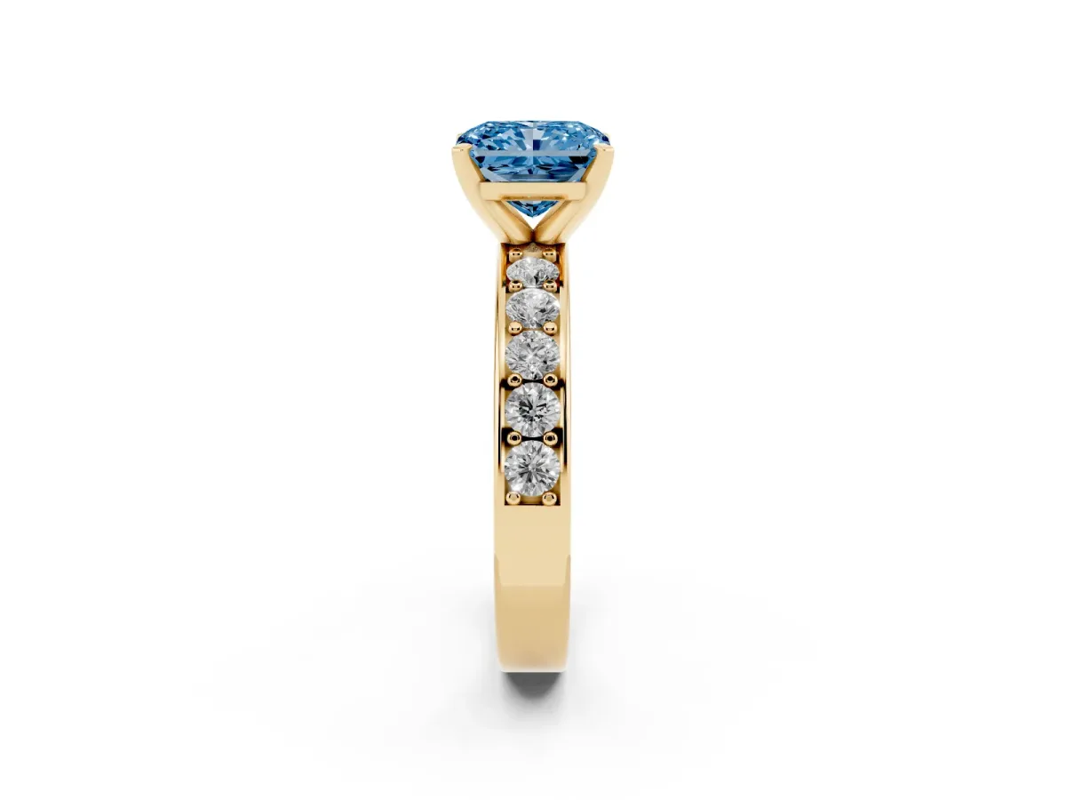 Fancy Blue Radiant Cut Diamond Engagement Ring with Channel Set Round Band and Prong Setting Yellow gold