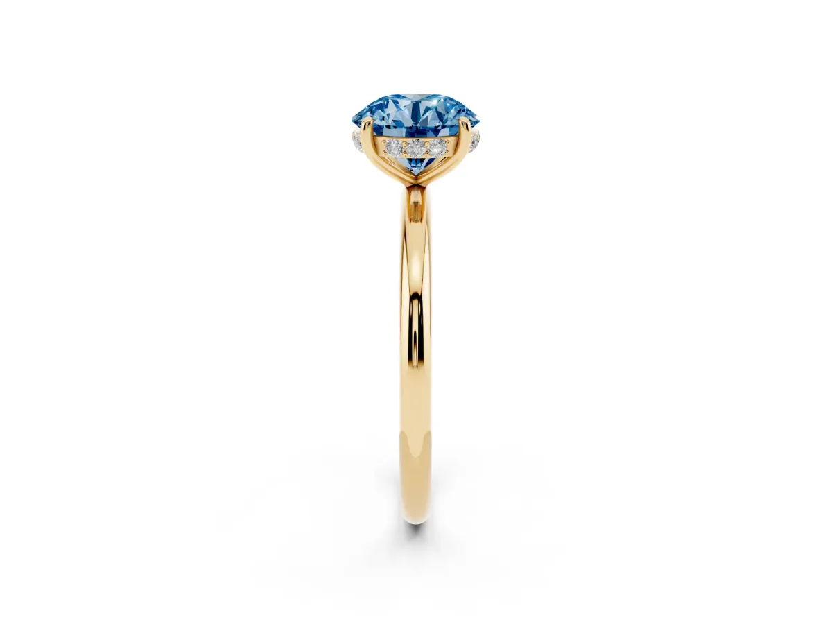 Fancy Blue Round Cut Solitaire Diamond Ring with a Classic Band and Four-Prong Setting Yellow gold