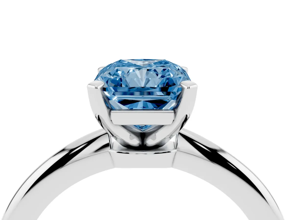 Fancy Blue Radiant Cut Diamond Solitaire Ring with Prong Setting and Classic Band Platinum
