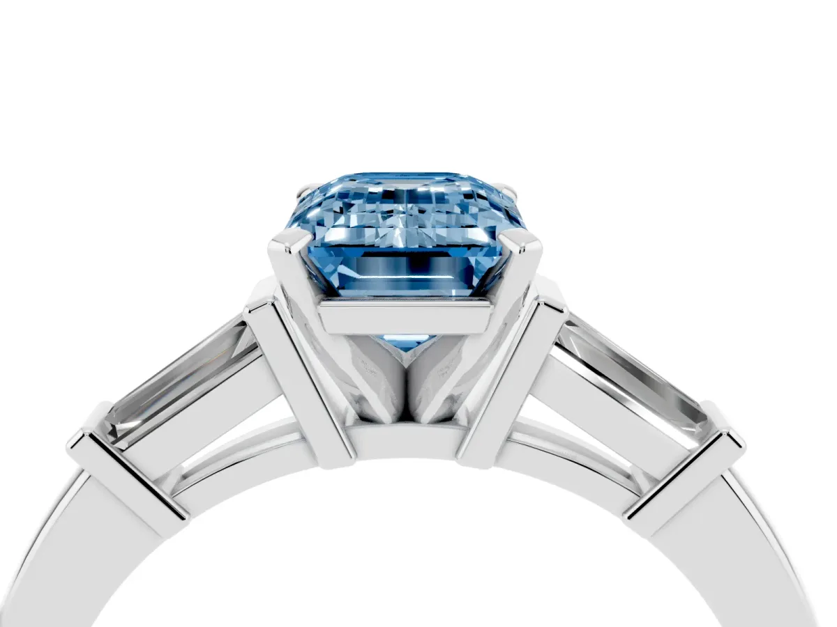 Fancy Blue Emerald Cut Cut Diamond Solitaire Ring with Tapered Baguette Accents and Four-Prong Setting Silver