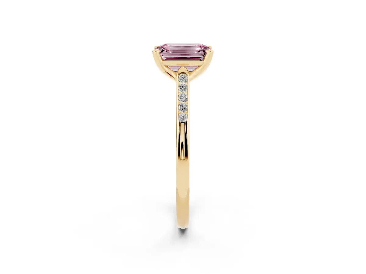 Fancy Pink Emerald Cut Diamond Solitaire Ring with Channel Set Round Band and Prong Setting Yellow gold