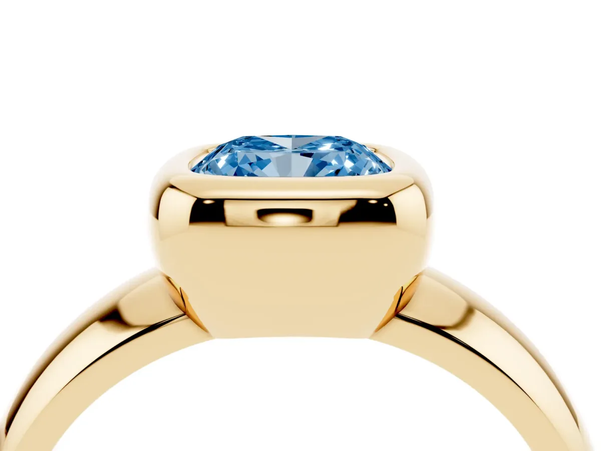 Fancy Blue Bezel Set Cushion Cut Solitaire Ring with Wide Band Yellow gold