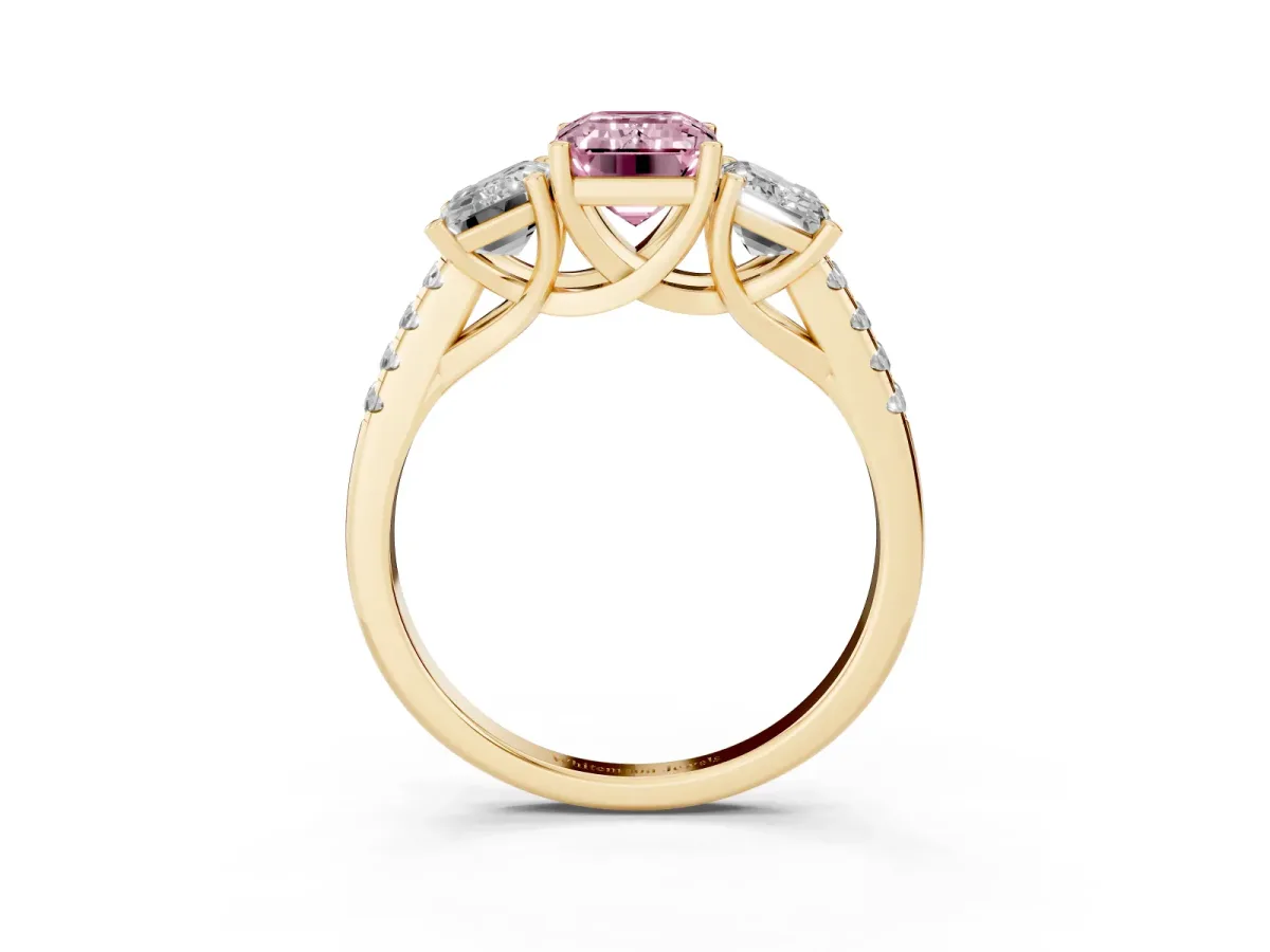 Fancy Pink Three-Stone Emerald Cut Diamond Ring with Round Pavé Band and Prong Setting Yellow gold