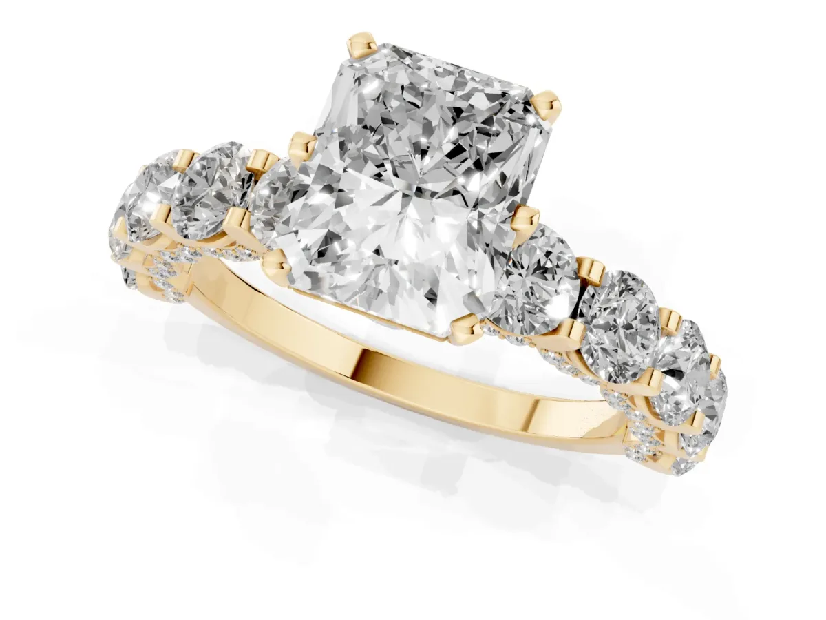 Radiant Cut Diamond Side Stone Engagement Ring with Four-Prong Setting Yellow gold
