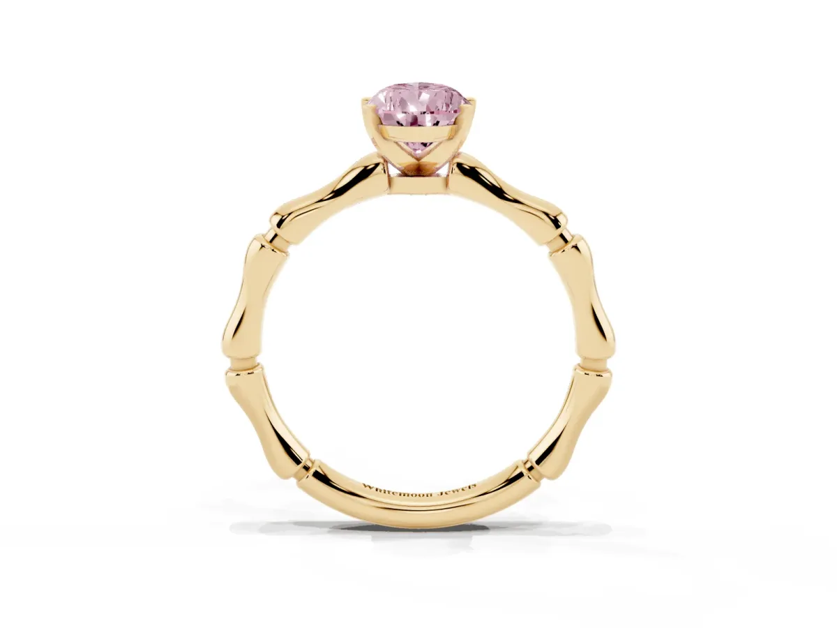 Fancy Pink Pear Cut Solitaire Diamond Ring with Bamboo Band and Four-Prong Setting Yellow gold