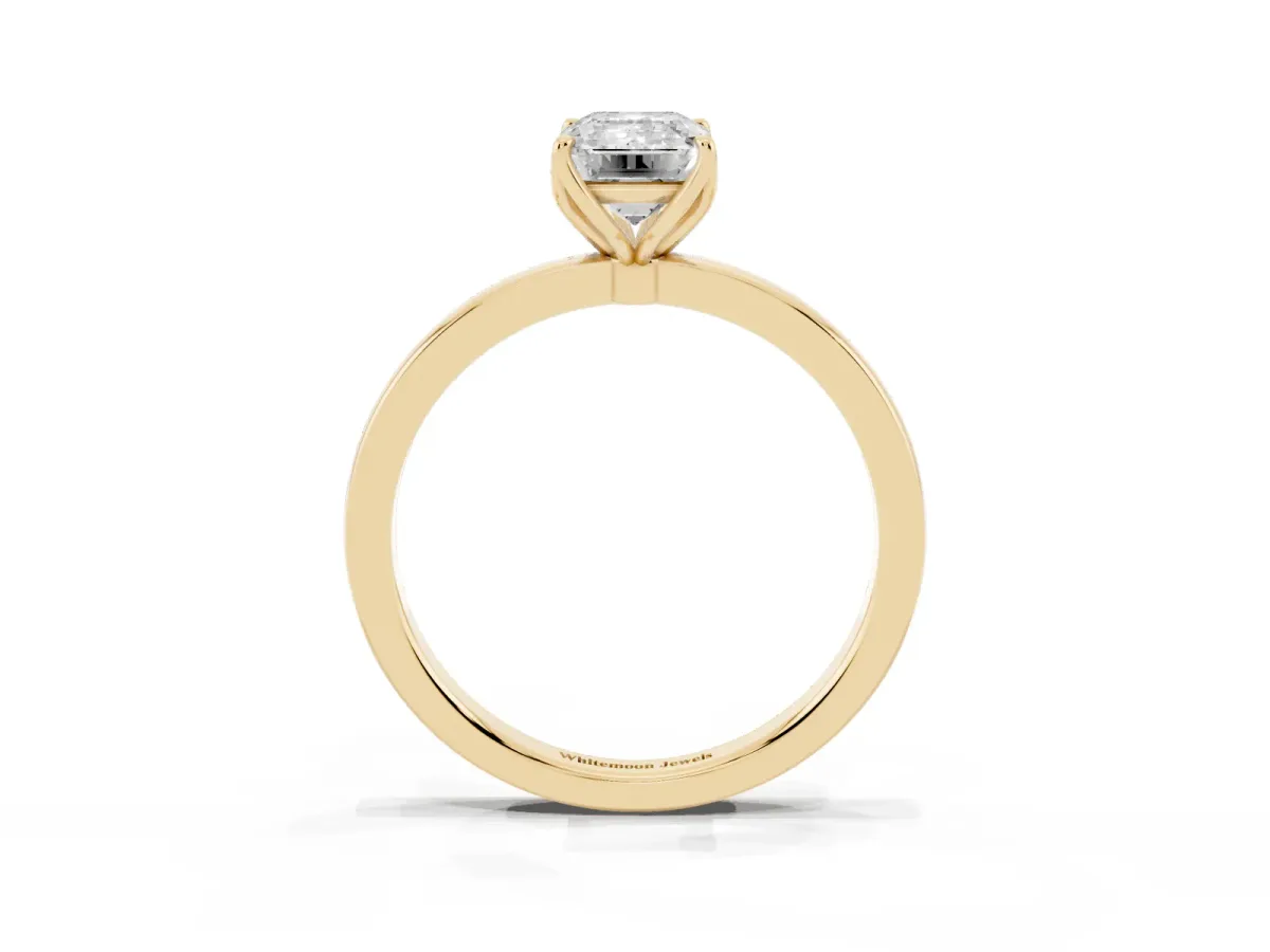 Emerald Cut Diamond Solitaire Ring with Thin Band and Prong Setting Yellow gold