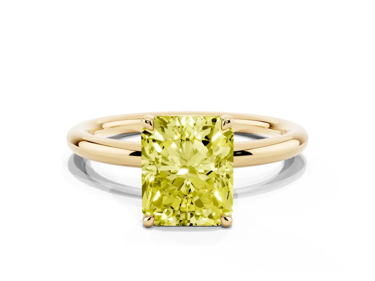 Fancy Yellow Radiant Cut Diamond Solitaire Ring with Thin Band and Four-Prong Setting Yellow gold