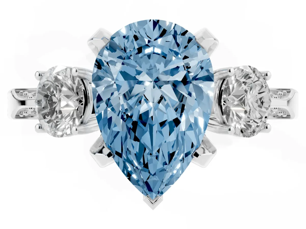 Fancy Blue Pear Cut Brilliant Three-Stone Diamond Ring with Pavé Band and Four-Prong Setting Silver
